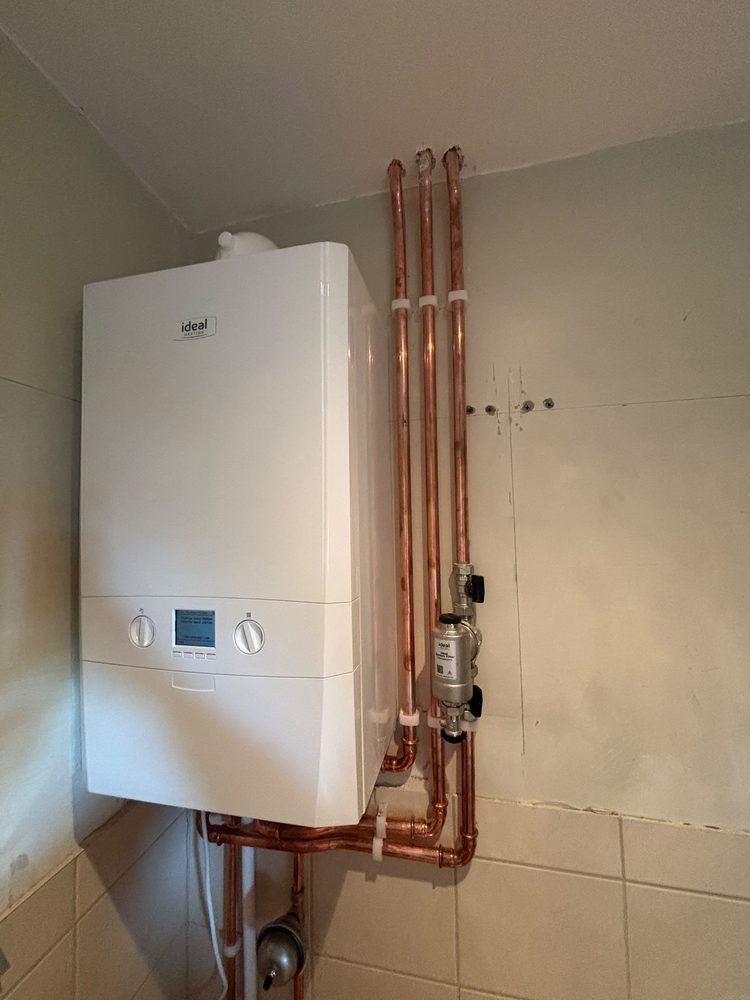 Finished boiler install with copper pipework by SWW