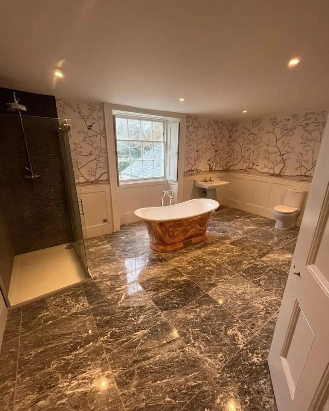 Luxury bathroom installation in Exeter by SWW — freestanding bath and marble tiling